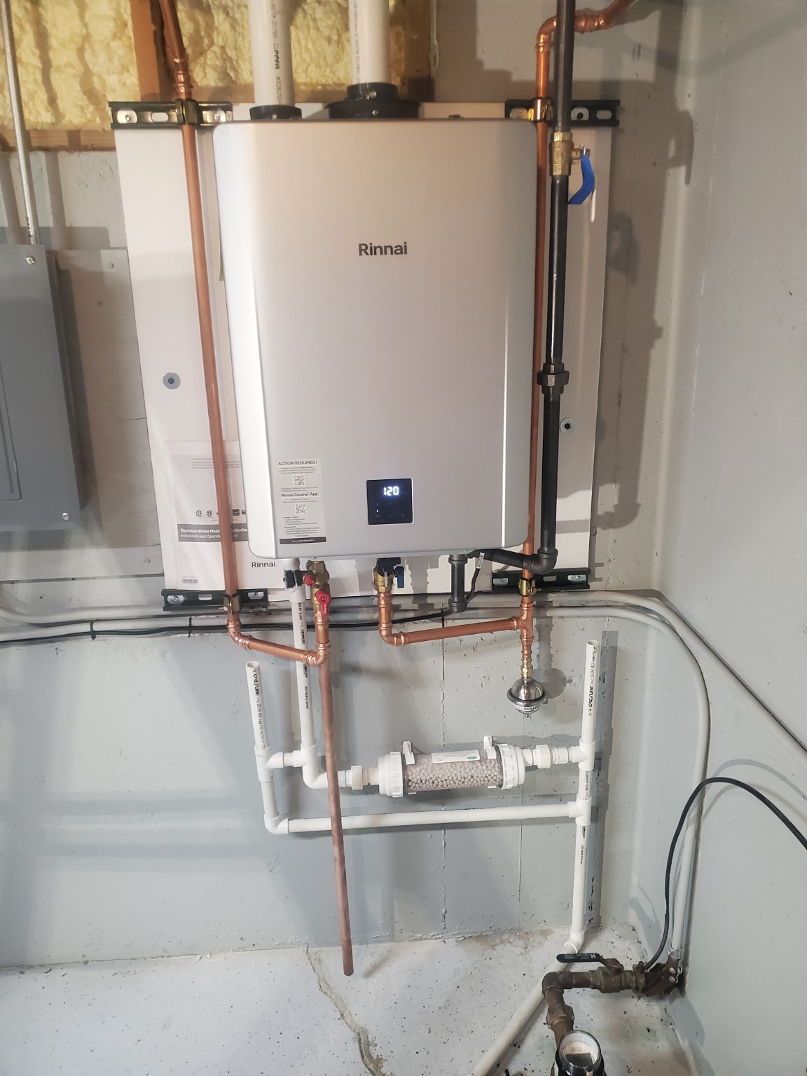 Completed wall-mounted Rinnai tankless water heater installation